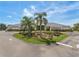 Community clubhouse with landscaping and palm trees at 5502 Bounty Cir, Tavares, FL 32778