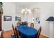 Bright dining room with hardwood floors and elegant chandelier at 5502 Bounty Cir, Tavares, FL 32778