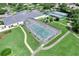 Aerial view of community pool with enclosed enclosure at 5502 Bounty Cir, Tavares, FL 32778