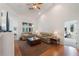 Living area with hardwood floors and access to bedroom at 5502 Bounty Cir, Tavares, FL 32778