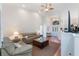 Living room with vaulted ceiling and neutral color palette at 5502 Bounty Cir, Tavares, FL 32778