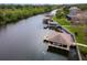 Bird's-eye view of waterfront homes and boat docks at 6216 Landings Blvd, Lady Lake, FL 32159