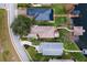 Aerial view of houses near a calm waterway, showcasing location and views at 6216 Landings Blvd, Lady Lake, FL 32159