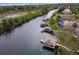 Aerial view of waterfront homes with private docks and lush landscaping at 6216 Landings Blvd, Lady Lake, FL 32159