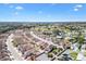 Expansive aerial view of a vibrant residential community featuring well-manicured lawns and mature trees at 629 Nuevo Leon Ln, The Villages, FL 32159