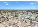 Picturesque aerial shot of a tranquil neighborhood with lush greenery and neatly arranged homes at 629 Nuevo Leon Ln, The Villages, FL 32159