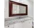 Bathroom featuring an oversized mirror, granite countertop vanity, white cabinetry, and a shower and tub combo at 629 Nuevo Leon Ln, The Villages, FL 32159