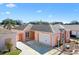 A lovely home shows off it's garage, a rock garden, and a neatly kept driveway at 629 Nuevo Leon Ln, The Villages, FL 32159