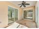 Inviting screened patio with ceiling fan offering a serene space for relaxation and outdoor enjoyment at 629 Nuevo Leon Ln, The Villages, FL 32159