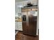 Stainless steel refrigerator in updated kitchen at 7 Cocos Plumosa Dr # A, Eustis, FL 32726