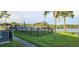 Inviting community pool area with a view of the lake at 7 Cocos Plumosa Dr # A, Eustis, FL 32726