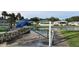 Community canal-front view with a blue pedestrian bridge at 7 Cocos Plumosa Dr # A, Eustis, FL 32726