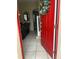 Inviting entryway with a red door and tiled floors at 762 Squirrel Ct, Kissimmee, FL 34759