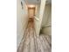 Long hallway with light wood laminate flooring at 762 Squirrel Ct, Kissimmee, FL 34759