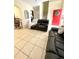 Living room featuring a red front door and hardwood stairs at 762 Squirrel Ct, Kissimmee, FL 34759