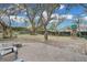 Large backyard with mature trees and playset at 7798 Snowberry Cir, Orlando, FL 32819