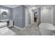 Spa-like bathroom featuring a soaking tub and walk-in shower at 7798 Snowberry Cir, Orlando, FL 32819