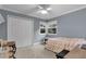 Comfortable bedroom with a double bed and ample closet space at 7798 Snowberry Cir, Orlando, FL 32819