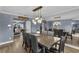 Farmhouse style dining room with sliding barn doors and mirrored accent wall at 7798 Snowberry Cir, Orlando, FL 32819