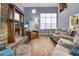 Living room featuring a fireplace, hardwood floors, and vaulted ceilings at 7798 Snowberry Cir, Orlando, FL 32819