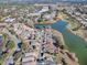 Aerial view showcasing home's location near lake and golf course at 8480 Se 167Th Forsyth St, The Villages, FL 32162