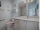 Bathroom with walk-in shower, granite vanity, and grab bars at 8480 Se 167Th Forsyth St, The Villages, FL 32162