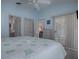 Bedroom with king-size bed and access to the patio at 8480 Se 167Th Forsyth St, The Villages, FL 32162