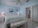 Main bedroom with king bed, ensuite bathroom access, and ceiling fan at 8480 Se 167Th Forsyth St, The Villages, FL 32162