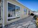 Exterior view showing a walkway, sliding window, and stucco wall at 8480 Se 167Th Forsyth St, The Villages, FL 32162