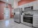 Stainless steel appliances and light wood cabinets in this kitchen at 8480 Se 167Th Forsyth St, The Villages, FL 32162