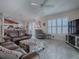 Living room features brown leather sectional and a fireplace at 8480 Se 167Th Forsyth St, The Villages, FL 32162