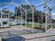 Enjoy the outdoors in this screened enclosure, overlooking the backyard at 8480 Se 167Th Forsyth St, The Villages, FL 32162