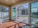 Bright screened lanai with access from the living room and sliding doors at 8480 Se 167Th Forsyth St, The Villages, FL 32162