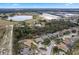 Aerial view showing house location near a lake and farmland at 9033 Laurel Ridge Dr, Mount Dora, FL 32757