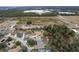 Aerial view of house and surrounding area, showcasing neighborhood and landscape at 9033 Laurel Ridge Dr, Mount Dora, FL 32757