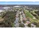 Aerial view of neighborhood with houses and golf course visible at 9033 Laurel Ridge Dr, Mount Dora, FL 32757