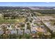 Aerial view of community, highlighting homes, golf course, and natural landscape at 9033 Laurel Ridge Dr, Mount Dora, FL 32757