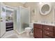 Bathroom with walk-in shower, toilet and access to spa at 9033 Laurel Ridge Dr, Mount Dora, FL 32757