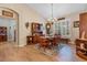 Bright dining room featuring hardwood floors and wooden furniture at 9033 Laurel Ridge Dr, Mount Dora, FL 32757