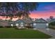 Beautiful one-story home with landscaped yard and paver driveway at 9033 Laurel Ridge Dr, Mount Dora, FL 32757