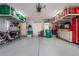 Organized garage with overhead storage and shelving at 9033 Laurel Ridge Dr, Mount Dora, FL 32757