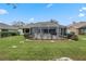 Charming home with lush landscaping and screened patio at 9033 Laurel Ridge Dr, Mount Dora, FL 32757