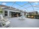 Expansive screened patio overlooking backyard at 9033 Laurel Ridge Dr, Mount Dora, FL 32757