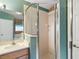 Bathroom with vanity, toilet, shower, and window at 9320 County Road 125B, Wildwood, FL 34785