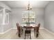 Bright dining room with a wooden table and chandelier at 9320 County Road 125B, Wildwood, FL 34785