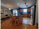 Kitchen with island, teal walls, and stainless steel appliances at 9616 Se 168Th Elderberry Pl, The Villages, FL 32162