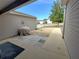 Small patio area with a walkway, situated between house and yard at 9616 Se 168Th Elderberry Pl, The Villages, FL 32162