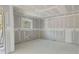 An unfinished room with fresh drywall, wiring, and a large window, awaiting customization at Lot 42 Indian Estates Cr 423, Lake Panasoffkee, FL 33538