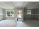 Unfinished room featuring fresh drywall, large windows, and an exterior door at Lot 42 Indian Estates Cr 423, Lake Panasoffkee, FL 33538