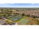 Aerial view of community with tennis and basketball courts at 16967 Se 93Rd Cuthbert Cir, The Villages, FL 32162